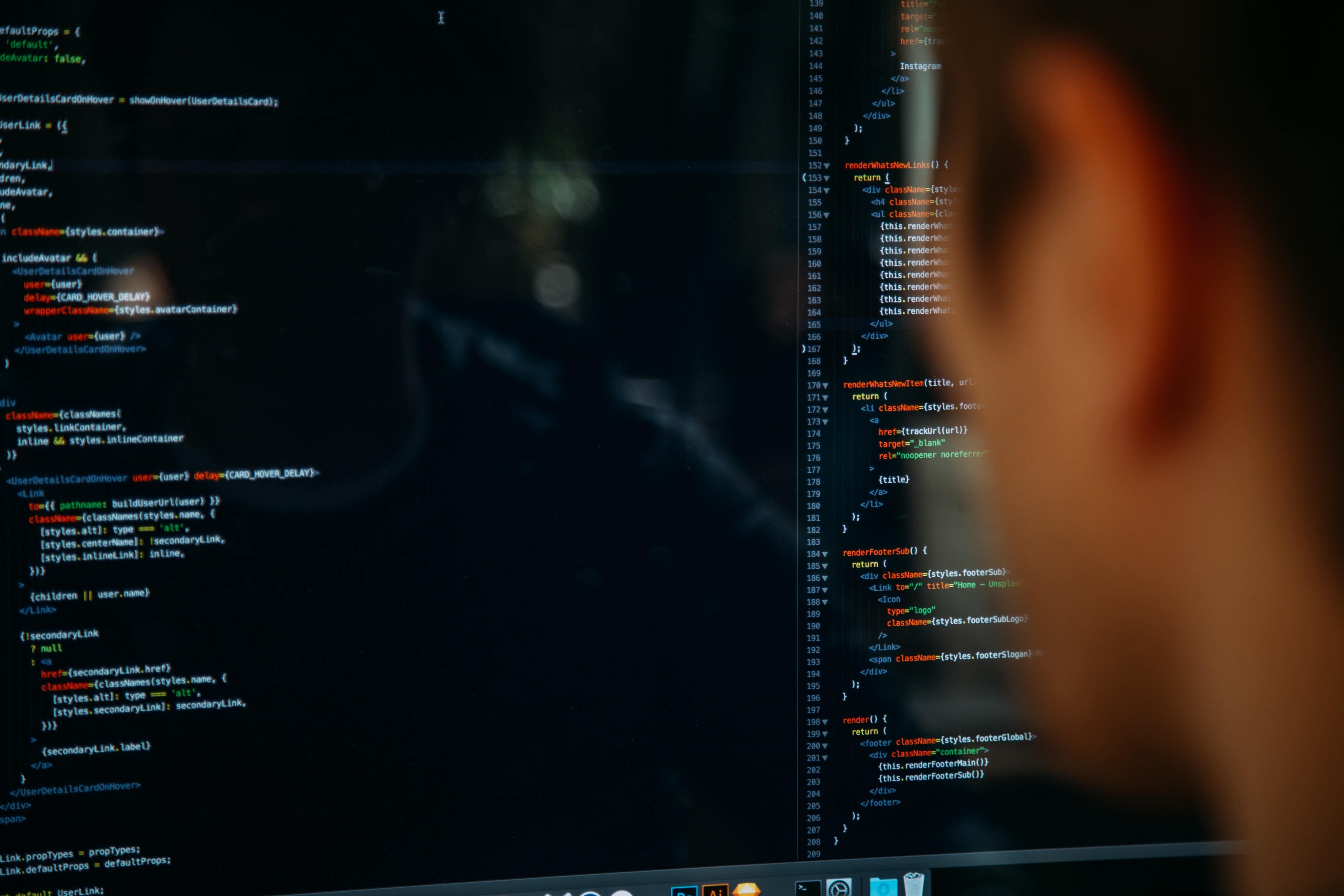 Someone looking at code on a monitor